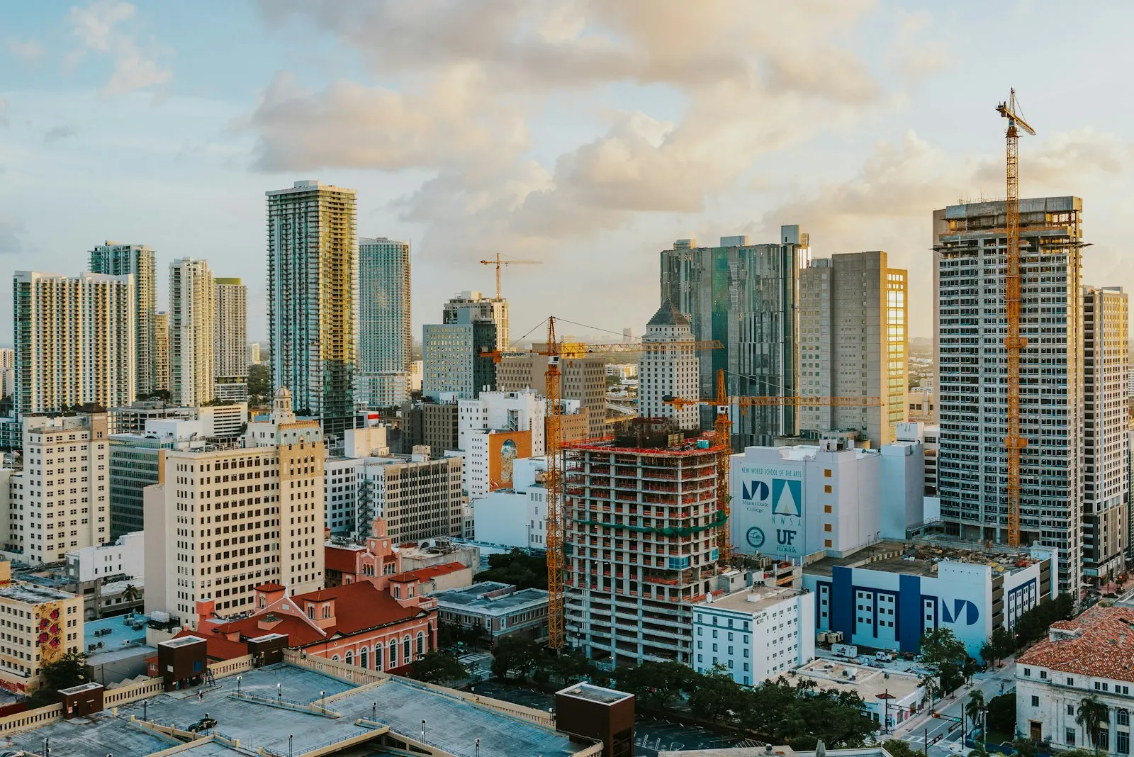 Freedom Tower among downtown Miami buildings in golden-hour light