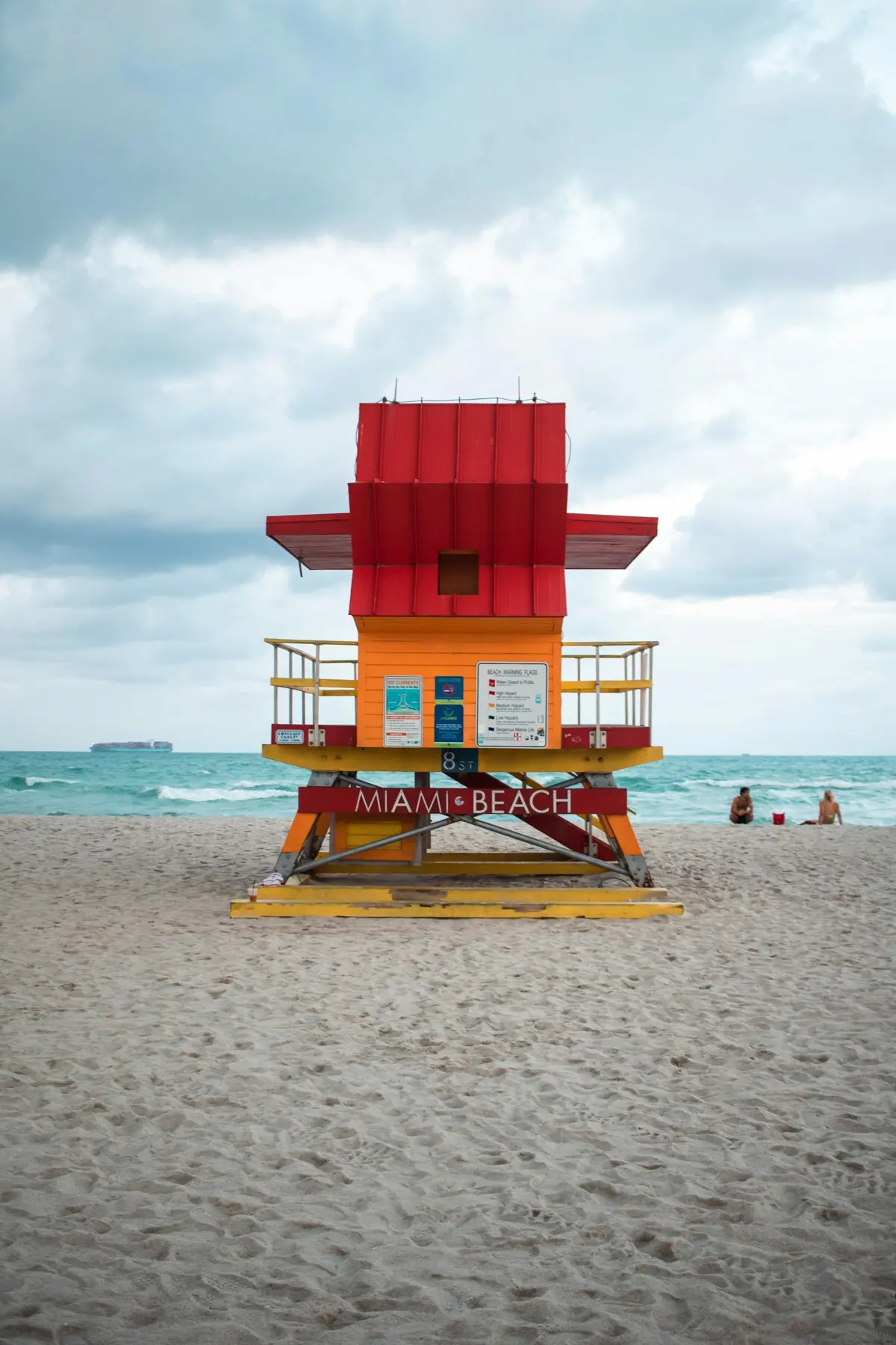 Red and yellow Miami Beach lifeguard tower on South Beach beside the Atlantic